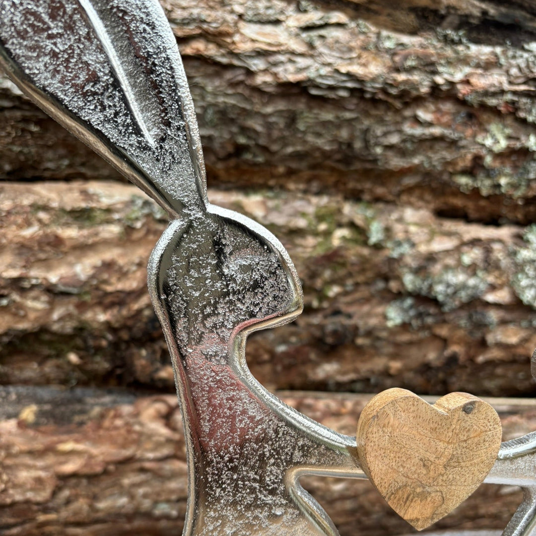 Silver metal rabbit stand on mango wood base (W/H/D) 29x29x5cm