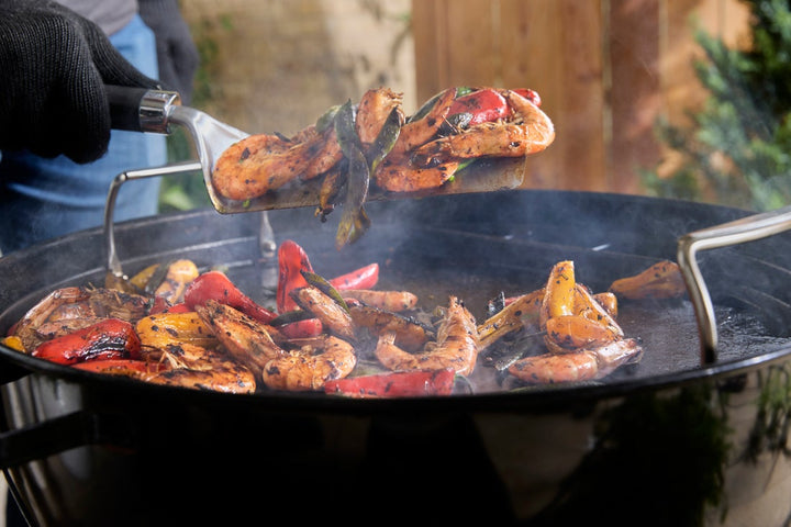 Shrimp Barbecuing on a Weber Full-Size Griddle on a Weber charcoal barbecue