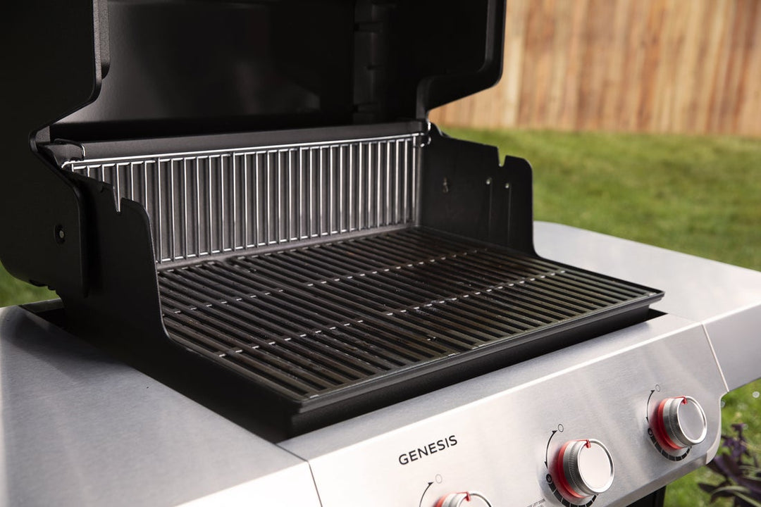 Weber Genesis E-315 view of the grill grates on a grass background