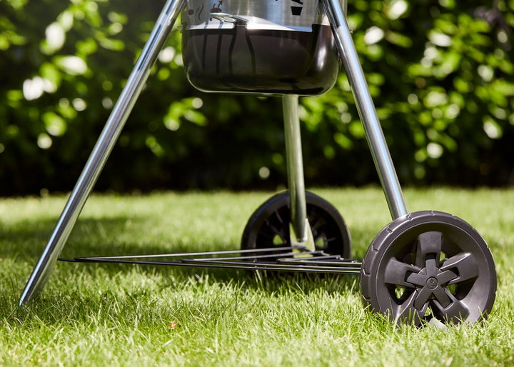 Wheels from a Weber E-5750 on a lawn